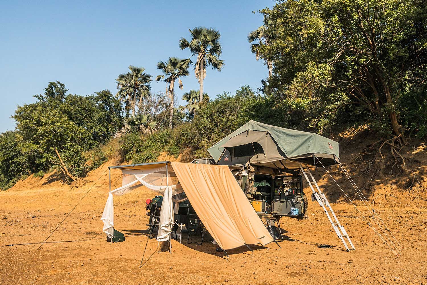 ARB Touring 2500x2500 awning in use on overlander camp with sidewall