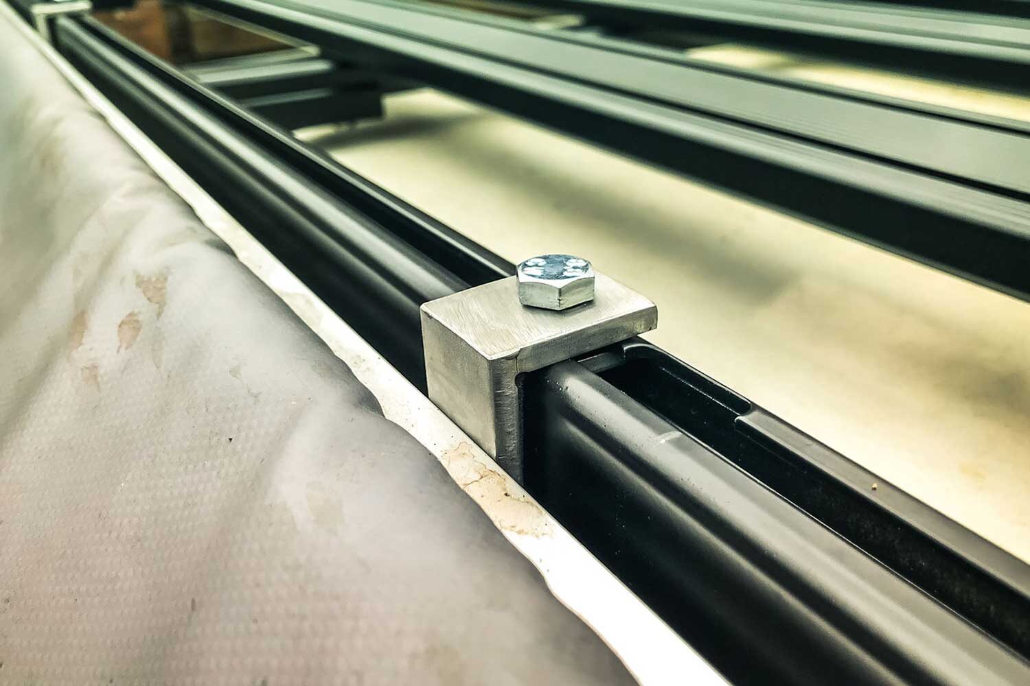 Custom made brackets for the ARB Touring Awning to use on the Tembo roof rack