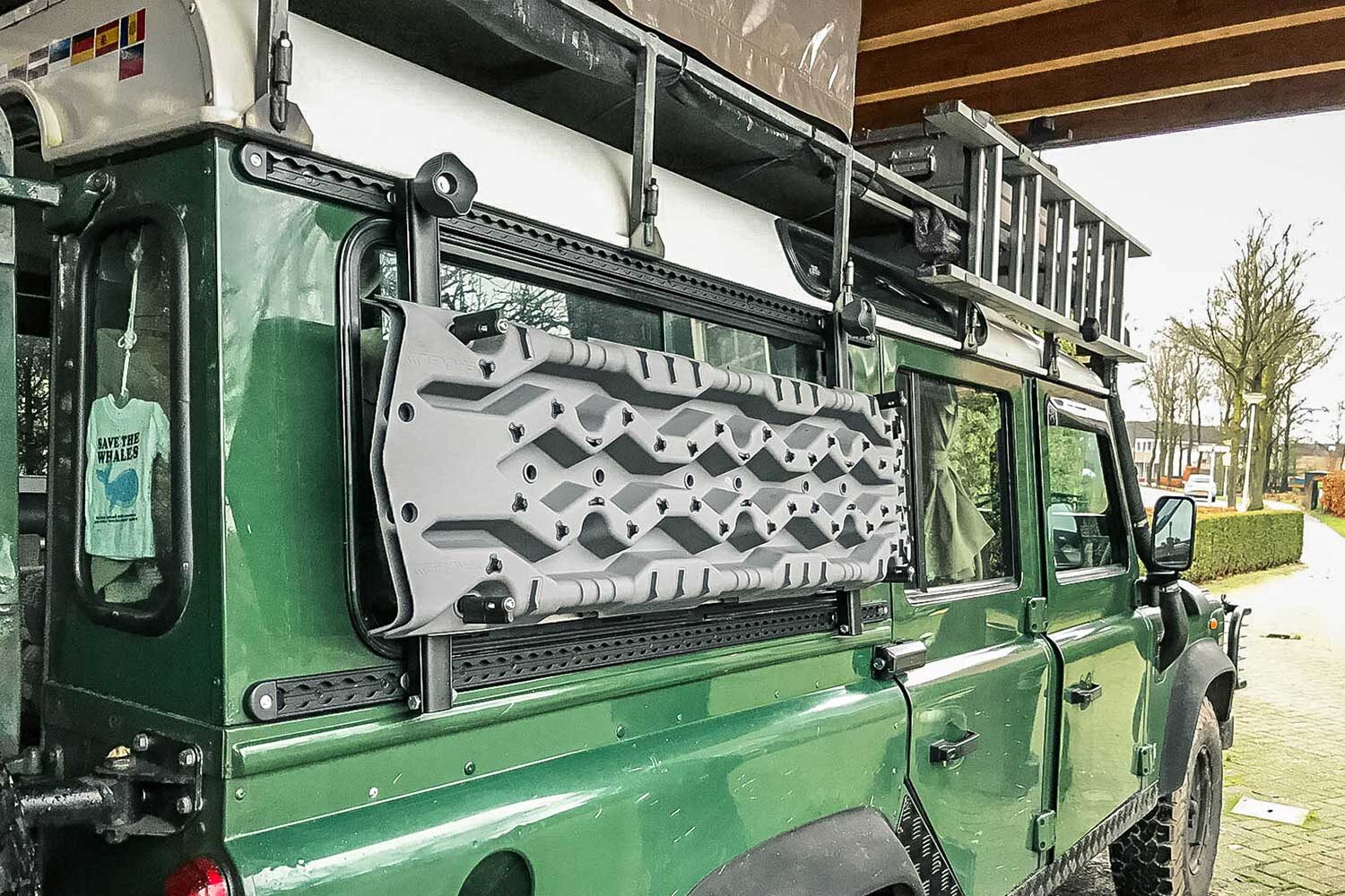 Tred Pro recovery boards mounted on the overland Defender