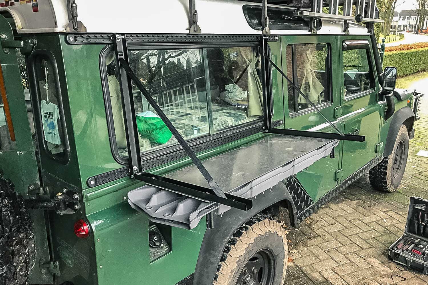 Drop down table made from recovery boards on the overland Defender